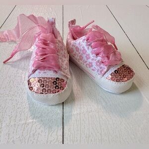 White and pink boutique, Conver style crib shoes.